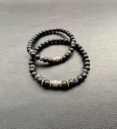 Black obsedian with silver and bras. For him and her.